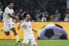 Indonesia's Thom Jan Haye (right) celebrates with a teammate after scoring a goal during the 2026 FIFA World Cup Asian qualification soccer match between Indonesia and the Philippines at Gelora Bung Karno stadium in Jakarta on June 11, 2024.