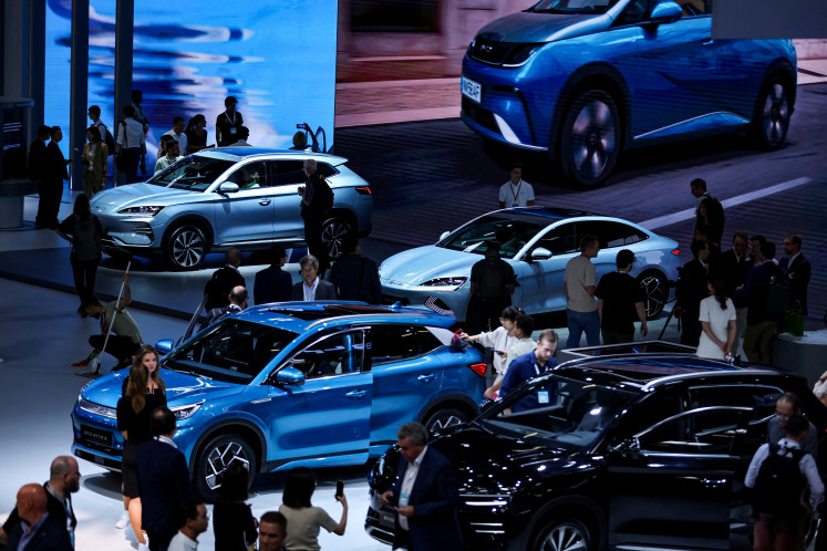 A general view of visitors looking at cars from Chinese automobile manufacturer BYD a day ahead of the official opening of the 2023 Munich Auto Show IAA Mobility, in Munich, Germany, on Sept. 4, 2023.