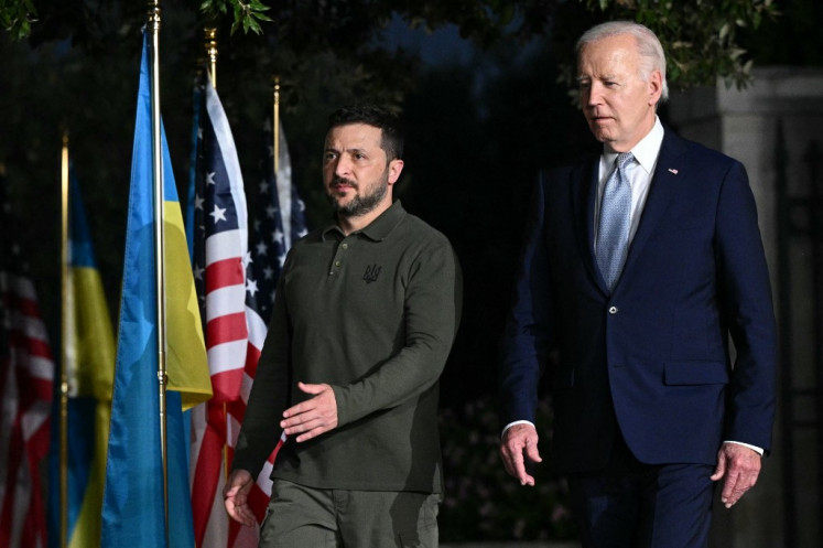 US President Joe Biden and Ukrainian President Volodymyr Zelensky arrive to sign a bilateral security agreement at the Masseria San Domenico on the sidelines of the G7 Summit hosted by Italy in Apulia region, on June 13, 2024 in Savelletri. 
