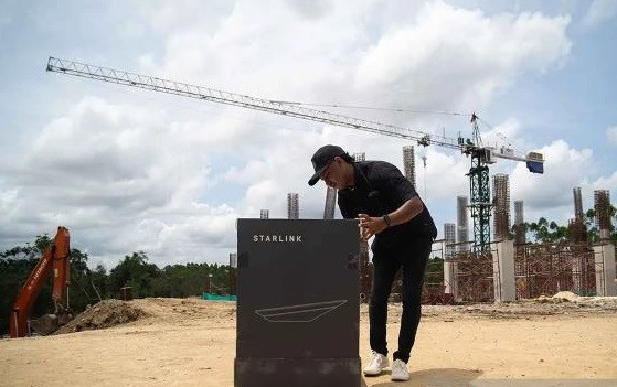 Linking up: An officer prepares Starlink flat high-performance kit in the construction site of future capital city Nusantara in North Penajam Paser, East Kalimantan, on May 18, 2024. The Tony Blair Institute for Global Change (TBI) provides high-speed satellite internet access in 10 spots across Nusantara.  