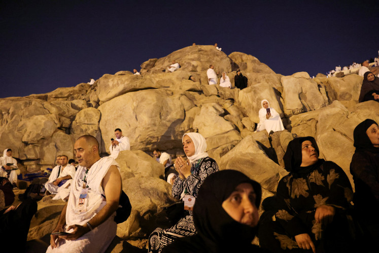 Muslim pilgrims gather at Mount of Mercy on the plain of Arafat during the annual haj pilgrimage, outside the holy city of Mecca, Saudi Arabia, June 15, 2024. 