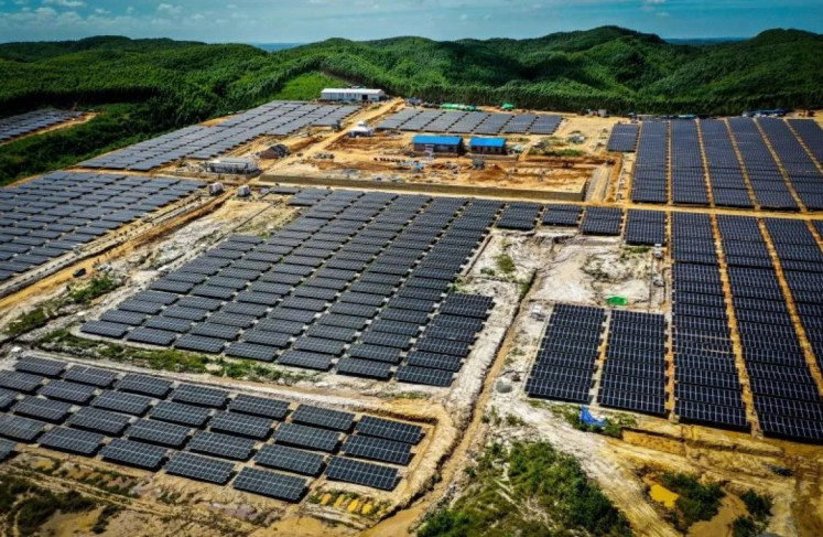 Solar photovoltaic panels stand on Feb. 15, 2024 at the site of a solar power plant under development in Nusantara, North Penajam Paser regency, East Kalimantan.