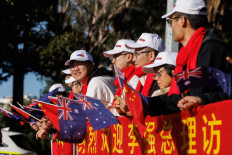 Members of the Australian-Chinese community await the arrival of China's Premier Li Qiang and Australian Prime Minister Anthony Albanese to Kings Park before an Australia-China CEO Roundtable in Perth on June 18, 2024.