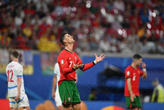 Portugal's forward #07 Cristiano Ronaldo reacts during the UEFA Euro 2024 Group F football match between Portugal and the Czech Republic at the Leipzig Stadium in Leipzig on June 18, 2024. 
