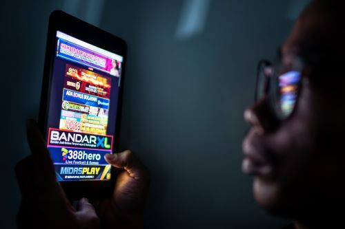 Online war: A person watches an online gambling advertisement on their tablet on June 19, 2024. The Communication and Information Ministry has blocked 2.1 million websites as part of the fight against online gambling.