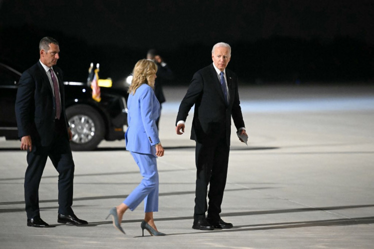 US President Joe Biden and First Lady Jill Biden walk to board Air Force One before departing Dobbins Air Reserve Base in Marietta, Georgia on June 27, 2024. 