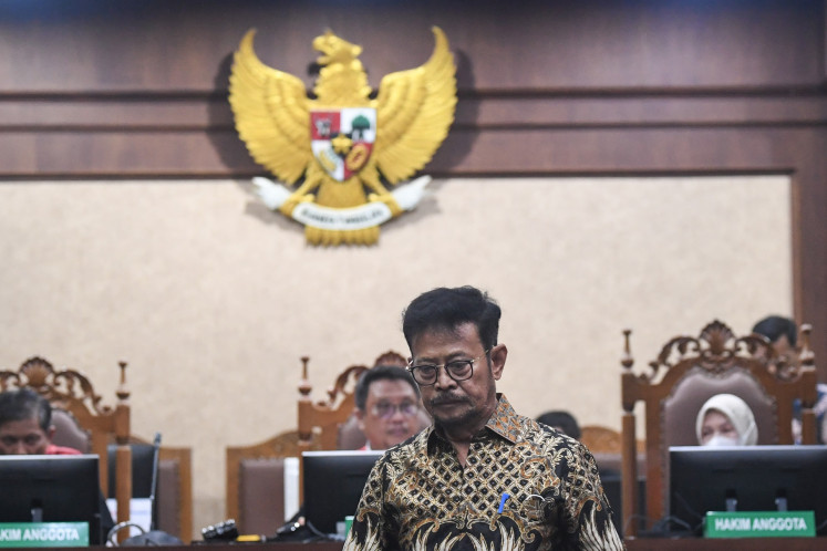 Former agriculture minister and graft defendant Syahrul Yasin Limpo heads to the defendant's chair during a sentence demand hearing against him at the Jakarta Corruption Court in Jakarta on June 28, 2024.