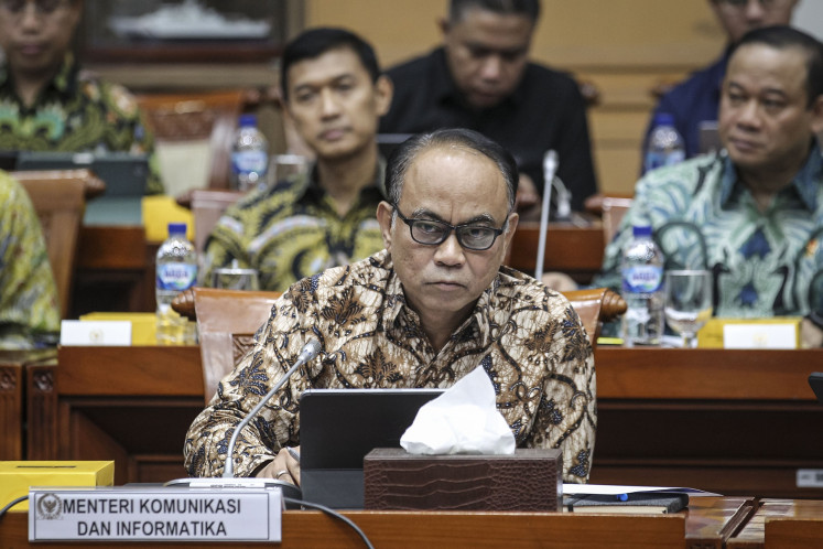 Communications and Information Minister Budi Arie Setiadi (center) sits during a meeting about the Brain Cipher ransomware attack on the temporary National Data Center facilities with House of Representatives Commission I overseeing communications and information at the Senayan legislative complex in Jakarta on June 27, 2024.