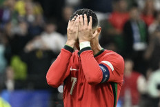 Portugal's forward #07 Cristiano Ronaldo reacts after failing to score a penalty kick during the UEFA Euro 2024 round of 16 football match between Portugal and Slovenia at the Frankfurt Arena in Frankfurt am Main on July 1, 2024.