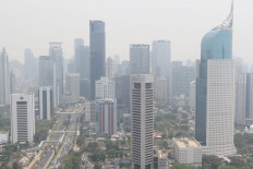Thick smog blankets the high rise buildings of Jakarta's business district on Jl. Sudirman on Oct. 9, 2019. 
