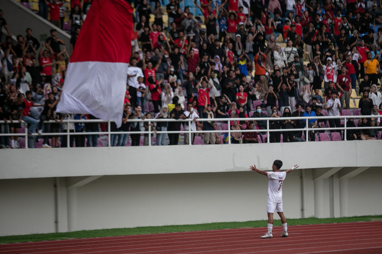 Indonesian soccer player Muhamad Zahaby Gholy celebrates with supporters after scoring a goal during the 2024 ASEAN U-16 Boys Championship third place play-off match against Vietnam at Manahan Stadium in Surakarta, Central Java, on July 3, 2024. Indonesia beat Vietnam 5-0, winning third place in the competition.