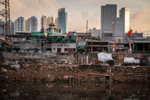 River of life: A man sits in front of his makeshift house in the banks of the Ciliwung River in Roxy area, West Jakarta, on June 27, 2024. The poor accounted for 4.44 percent of the population in Jakarta last year, down from 4.69 percent in the previous year.