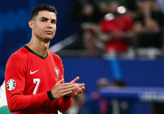 Portugal's forward #07 Cristiano Ronaldo reacts at the end of the UEFA Euro 2024 quarter-final football match between Portugal and France at the Volksparkstadion in Hamburg on July 5, 2024. 