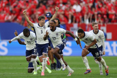 (Frm left) England's forward #21 Eberechi Eze, England's defender #05 John Stones, England's forward #17 Ivan Toney, England's midfielder #10 Jude Bellingham and England's midfielder #24 Cole Palmer celebrate at the end of the penalty shootout as they win the UEFA Euro 2024 quarter-final football match between England and Switzerland at the Duesseldorf Arena in Duesseldorf on July 6, 2024. 
