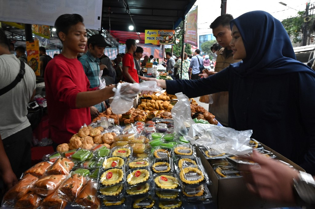 People buy food to break their fast on March 13, 2024, during the holy month of Ramadan.