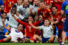 Spain's players celebrate after winning the UEFA Euro 2024 semi-final football match between the Spain and France at the Munich Football Arena in Munich, Germany on July 9, 2024.