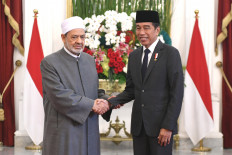 President Joko "Jokowi" Widodo shakes hands with Al Azhar University Grand Imam Muhammad Ahmad Al Thayyib on July 9, 2024, at the State Palace in Jakarta. During his third visit to Indonesia, the Grand Imam is slated to give an open lecture at National Islamic University (UIN) Syarif Hidayatullah Jakarta and hold an interfaith dialogue with a number of religious figures. 