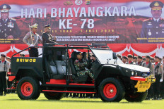 Papua Police chief Insp. Gen. Mathius Fakhiri (second left) inspects police personnel on July 1, 2024, during the 78th National Police anniversary commemoration ceremony in Jayapura, Papua.