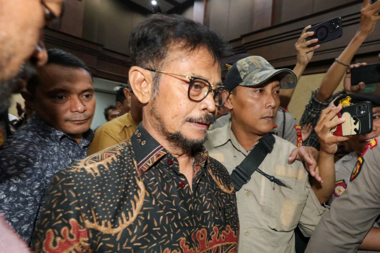 Former agriculture minister Syahrul Yasin Limpo leaves the courtroom after hearing the judges' verdict in Jakarta on July 11, 2024. He was jailed for 10 years on July 11 after he was found guilty of misappropriating more than $900,000 of public funds.