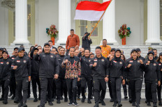 President Joko “Jokowi“ Widodo (center) gestures as he joins Indonesian athletes who will compete in the upcoming Paris 2024 Olympic Games during a send-off ceremony at the Merdeka Palace in Jakarta on Wednesday, July 10, 2024. Indonesia sends 29 athletes from12 sports to compete in the quadrennial event.