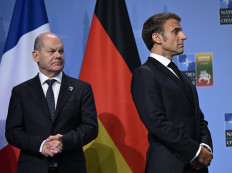 German Chancellor Olaf Scholz (left) and French President Emmanuel Macron attend a Group of Seven event to announce the Joint Declaration of Support for Ukraine on July 12, 2023, during the NATO Vilnius Summit in Lithuania.
