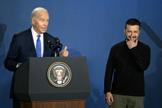 US President Joe Biden corrects himself after accidentally introducing  Ukraine's President Volodymyr Zelensky (right) as Russia's President Vladimir Putin during the Ukraine Compact initiative on the sidelines of the NATO Summit at the Walter E. Washington Convention Center in Washington, DC, on July 11, 2024. 