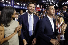 US senator J.D. Vance (R-OH) (center) and his wife Usha Chilukuri Vance look on as he is nominated for the office of vice president alongside Ohio delegate Bernie Moreno (right) on the first day of the Republican National Convention at the Fiserv Forum on July 15, 2024 in Milwaukee, Wisconsin, US. Delegates, politicians, and the Republican faithful are in Milwaukee for the annual convention, concluding with former president Donald Trump accepting his party's presidential nomination. The RNC takes place from July 15-18. 