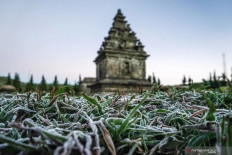 Frost that appeared due to a drop in temperature to minus 7 degrees Celsius envelopes the Arjuna Temple complex, in the Dieng highlands, Banjarnegara, Central Java, on June 25, 2019. 