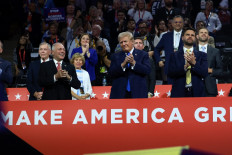 House Majority Leader Steve Scalise (R-LA), Republican presidential candidate and former United States president Donald Trump and Republican vice presidential candidate US Sen. J.D. Vance (R-OH) applaud on the second day of the Republican National Convention at the Fiserv Forum in Milwaukee, Wisconsin, the US, on July 16, 2024.