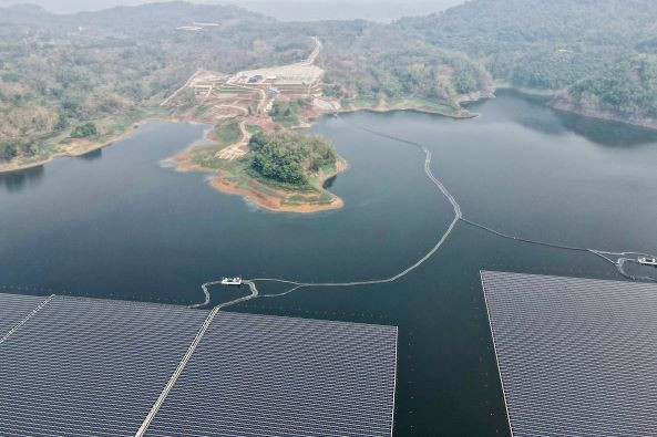 Power of cooperation: Hilly terrain forms a backdrop on Nov. 9, 2023 against the Cirata Floating Solar Power Plant at Cirata Reservoir in Purwakarta, West Java, the largest energy facility of its kind in Southeast Asia that was developed jointly by the Indonesian government and Abu Dhabi-owned renewable company Masdar of the United Arab Emirates.