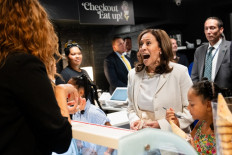 US Vice President Kamala Harris stops for ice cream at SMiZE and DREAM ice cream shop, owned by US model Tyra Banks, in Washington, US on July 19, 2024.