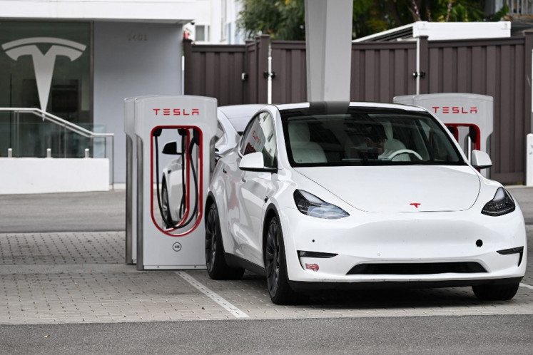 A Tesla electric vehicle charges in Santa Monica, California, US, on May 15, 2024.