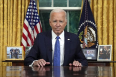 US President Joe Biden pauses as he concludes his address to the nation about his decision to not seek reelection, in the Oval Office at the White House in Washington, DC, on July 24, 2024. 