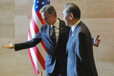 United States Secretary of State Antony Blinken (left) gestures to China's Foreign Minister Wang Yi as they meet on the sidelines of the 57th ASEAN Foreign Ministers' Meeting in Vientiane on July 27, 2024.