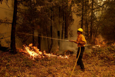 A firefighter operates in Lyonsville, California, the United States, on July 27, 2024. 