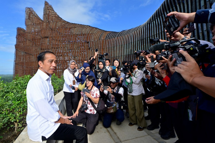 President Joko “Jokowi“ Widodo (left) talks to journalists on July 29, 2024 while visiting the newly built presidential palace in Nusantara, East Kalimantan, the country’s future capital.