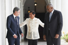 Philippines' President Ferdinand Marcos Jr. (center) greets US Secretary of State Antony Blinken (left) and US Secretary of Defense Lloyd Austin during a courtesy visit at the Malacanang Palace in Manila on July 30, 2024.  