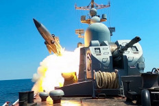 This grab taken from a handout footage released by the Russian Defense Ministry on July 21, 2023 shows a Russian Black Sea Fleet warship firing a cruise missile during drills in the Black Sea. 