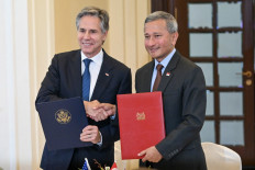 US Secretary of State Antony Blinken (left) and Singapore's Foreign Minister Vivian Balakrishnan shake hands during a signing ceremony at the Ministry of Foreign Affairs in Singapore on July 31, 2024. 