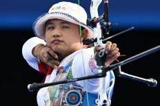 Indonesia's Rezza Octavia competes on August 1, 2024, during the archery women's individual elimination round during the Paris 2024 Olympic Games at the Esplanade des Invalides in Paris. Rezza failed to cruise from Round of 16 after being defeated 6-0 by South Korean archer Lim Si-hyeon. 