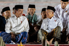 President Joko “Jokowi“ Widodo (center left) and Vice President Ma'ruf Amin (center right) share a glance on Aug. 1, 2024 while attending a congregational prayer at Merdeka Palace in Jakarta to mark the start of the month of Indonesian Independence celebrations.