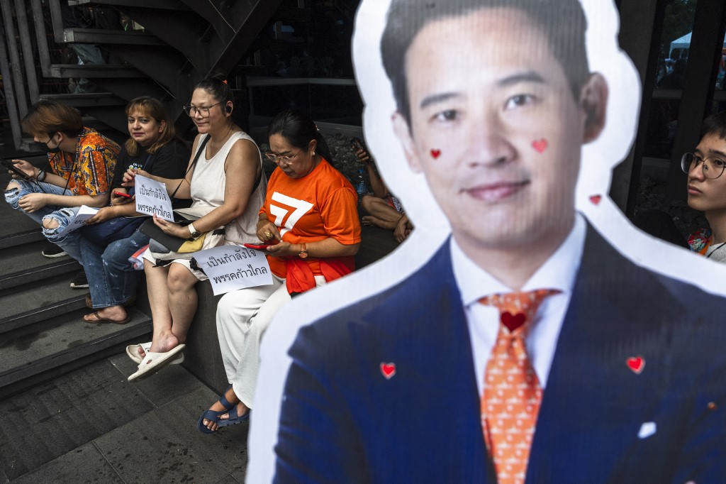 A cutout of Pita Limjaroenrat, the former leader of the now-dissolved Move Forward Party, stands before a group of supporters on Aug. 7, 2024 at the party&rsquo;s Bangkok headquarters. The popular politician said on Wednesday that he was &ldquo;highly confident&rdquo; of a favorable ruling before the country&rsquo;s top court ruled to dissolve the MFP and ban Pita from national politics for 10 years.