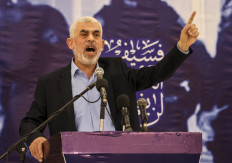 Head of the political wing of the Palestinian Hamas movement in the Gaza Strip Yahya Sinwar speaks during a meeting in Gaza City on April 30, 2022. Israel's foreign minister has called to “swiftly eliminate“ Yahya Sinwar, who was appointed by Hamas on August 6, 2024 as the militant group's new political leader replacing Ismail Haniyeh who was killed in Tehran last week.