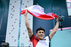Indonesia's Veddriq Leonardo celebrates after winning the men's sport climbing speed final during the Paris 2024 Olympic Games at Le Bourget Sport Climbing Venue in Le Bourget on Aug. 8, 2024.