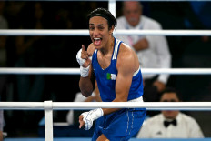 Algeria's Imane Khelif (Blue) reacts after beating Thailand's Janjaem Suwannapheng in the women's 66kg semi-final boxing match during the Paris 2024 Olympic Games at the Roland-Garros Stadium, in Paris on August 6, 2024. 