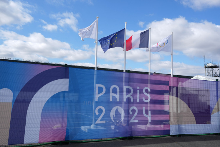 The Olympic rings, French and European Union flags wave at the 2024 Olympic Games in Paris international broadcast center at Parc des Expositions on July 22, 2024.