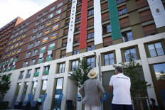 Hungary Minister of Defense and Sport Kristof Szalay-Bobrovniczky (left) stands outside the accommodation of Hungarian team at the Olympic Village in Paris on July 28, 2024.