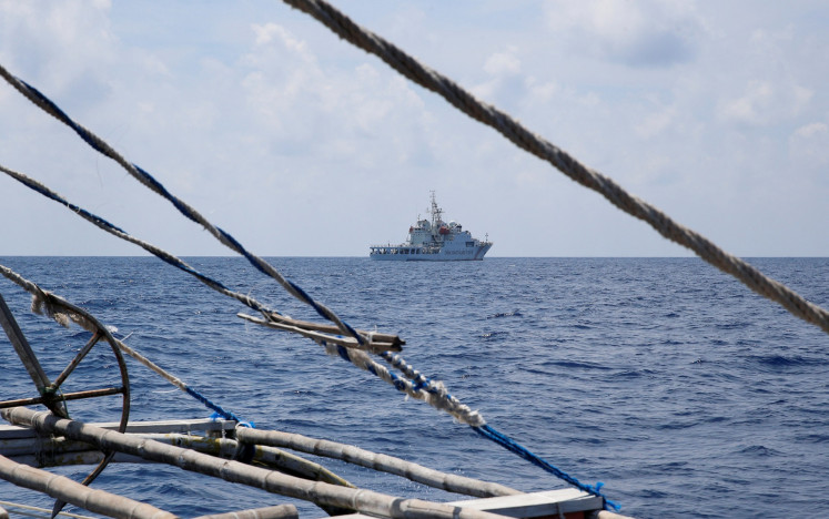 A China Coast Guard ship is seen from a Philippine fishing boat at the disputed Scarborough Shoal in a picture taken on April 6, 2017.