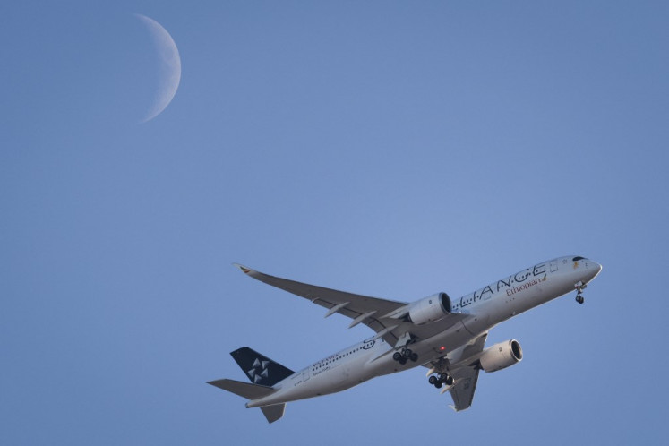 An Ethiopian Airlines plane lands at Heathrow Airport on the outskirts of London on Jan. 15, 2024.