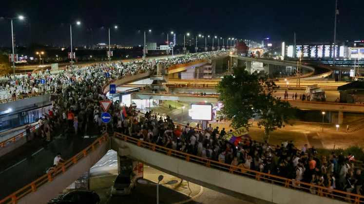 People block a highway during a protest against Rio Tinto's lithium mining project, in Belgrade, on Aug. 10, 2024.